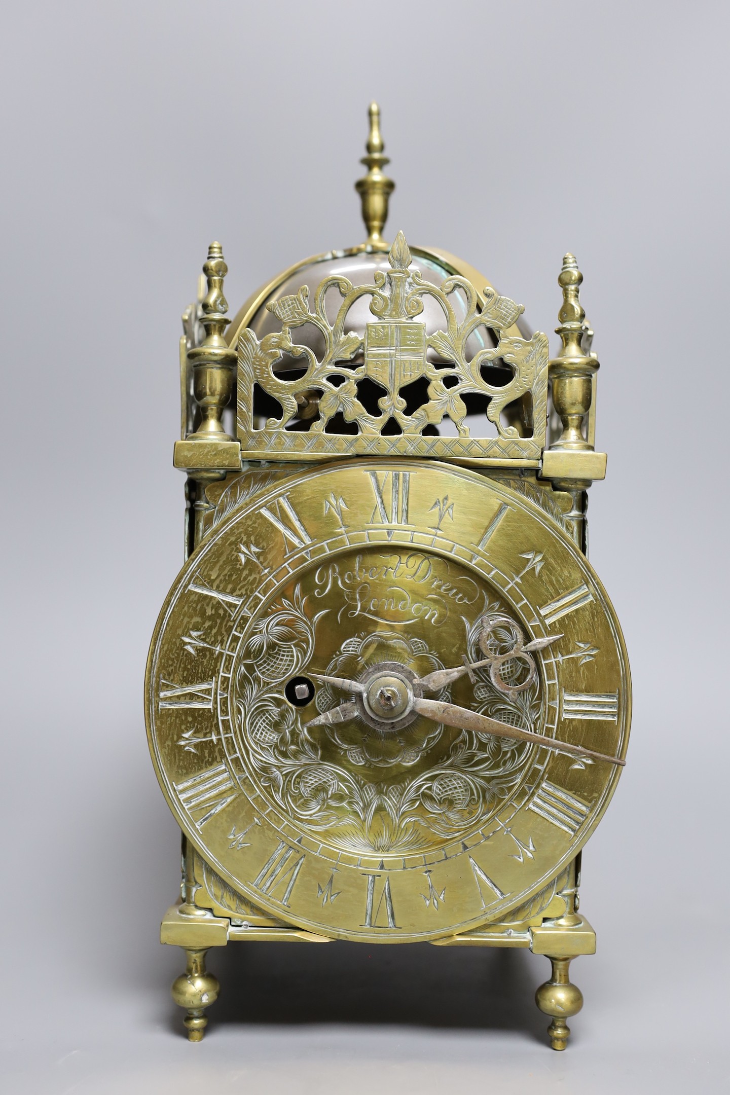 A brass lantern clock, signed Robert Drew, London, single fusee movement, 34 cms high